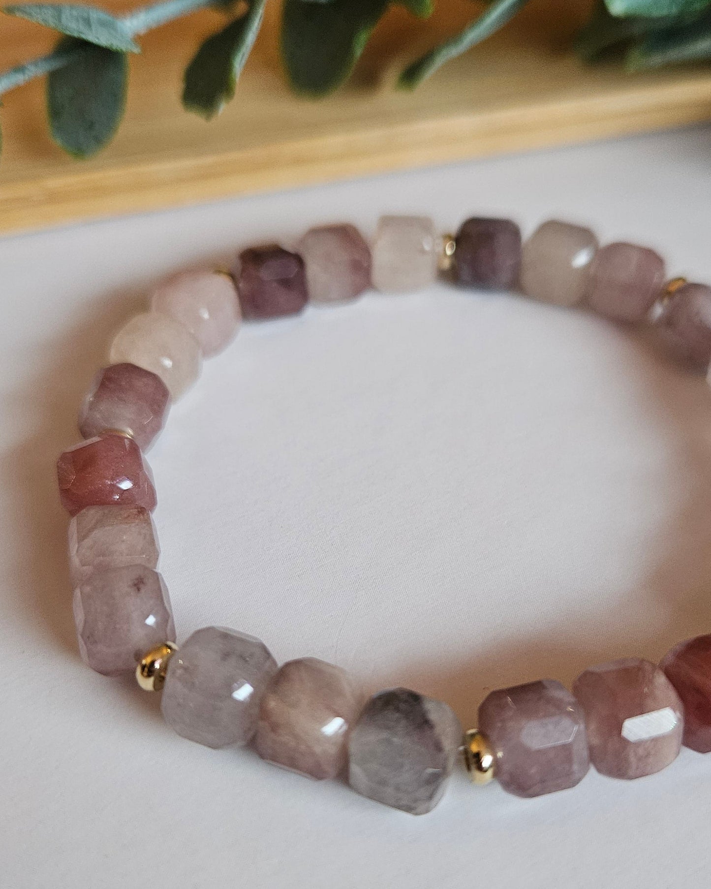 purple beaded bracelet with gold