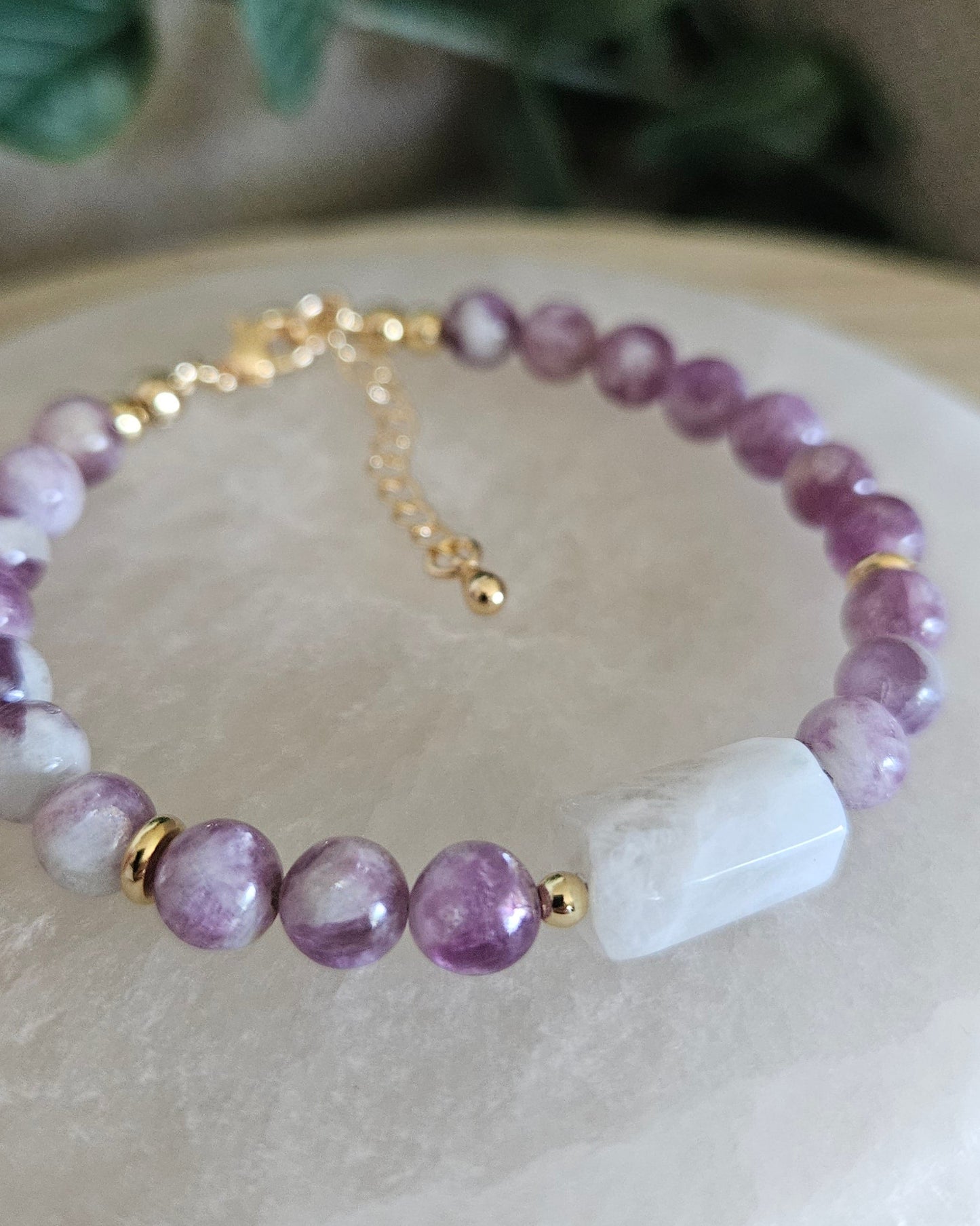 Close-up of the rectangular Moonstone focal, purple Lepidolite beads and gold-plated accents