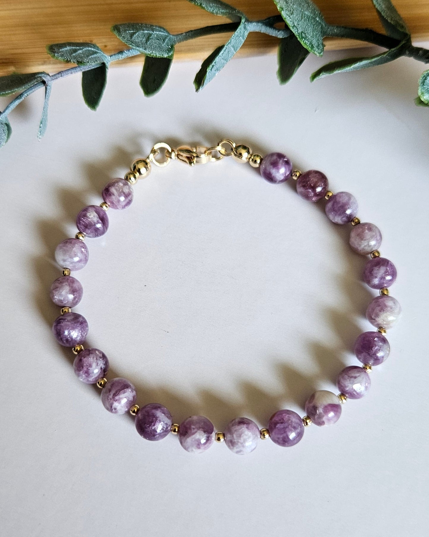 Purple beaded bracelet with gold