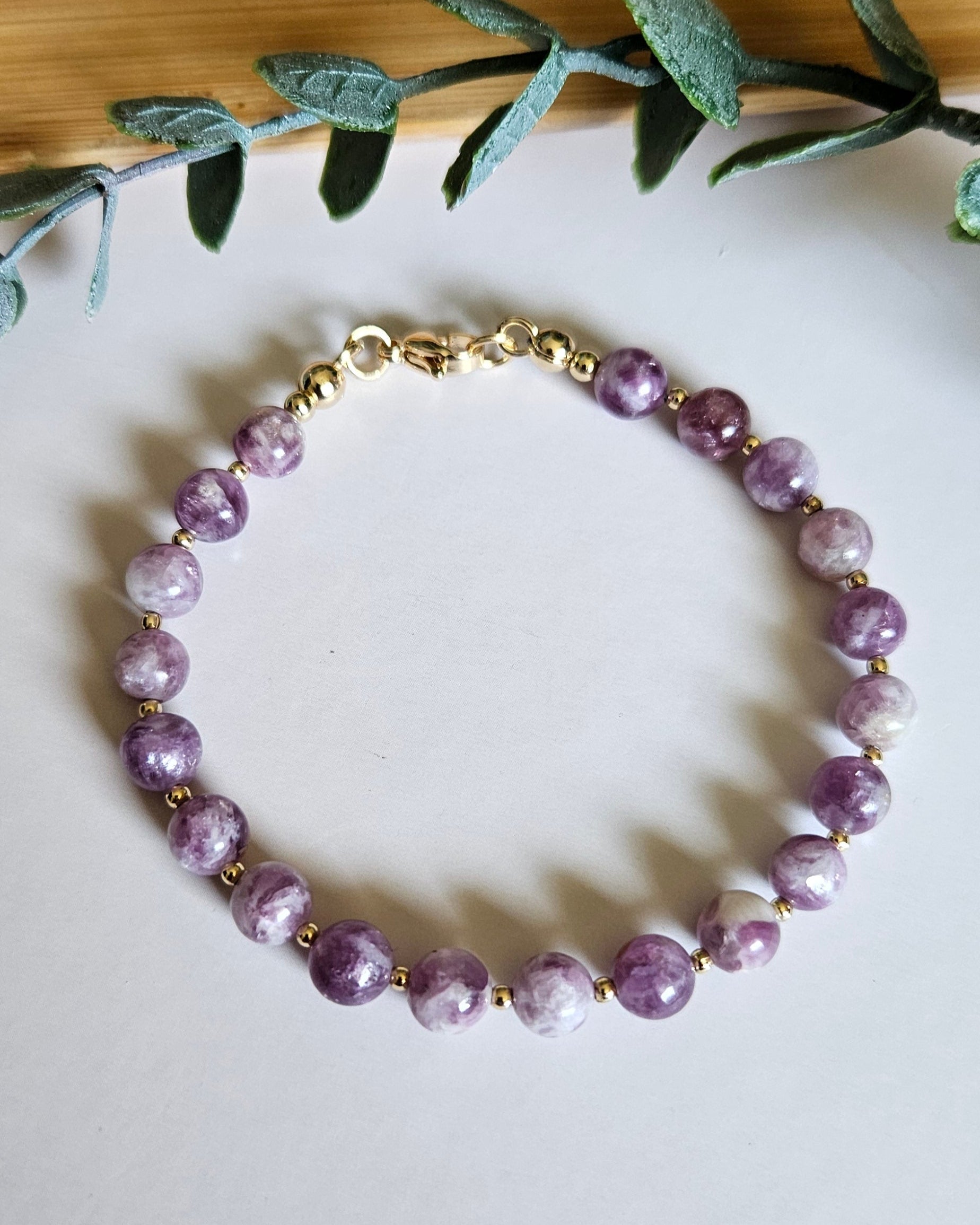 Purple beaded bracelet with gold