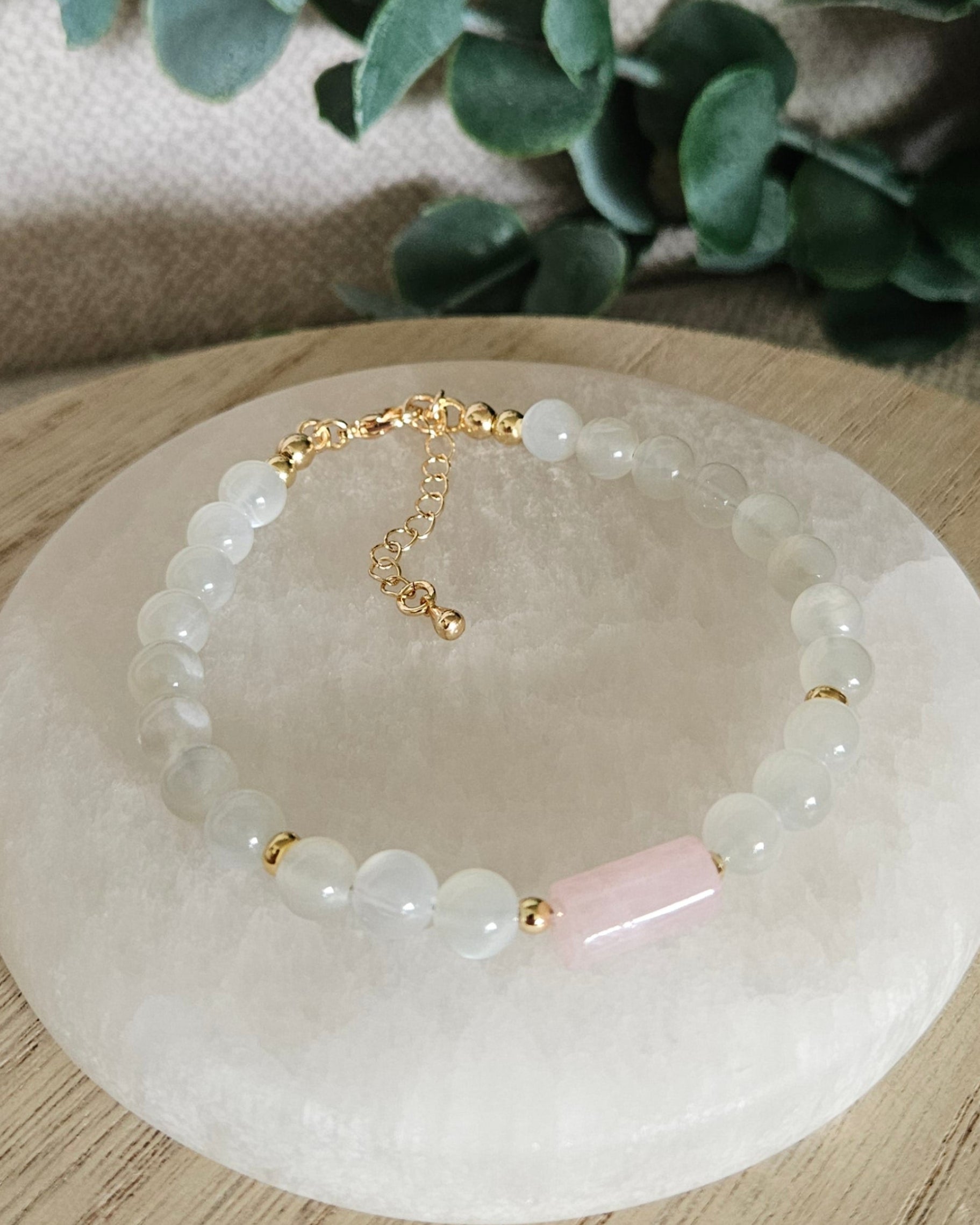 Overhead view of the White Moonstone and Rose Quartz bracelet with gold-filled clasp and extender chain