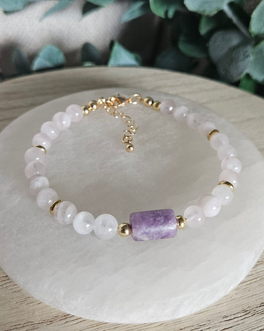 Rose Quartz bracelet with a rectangular Lepidolite focal stone, gold-plated accents and extender chain on selenite