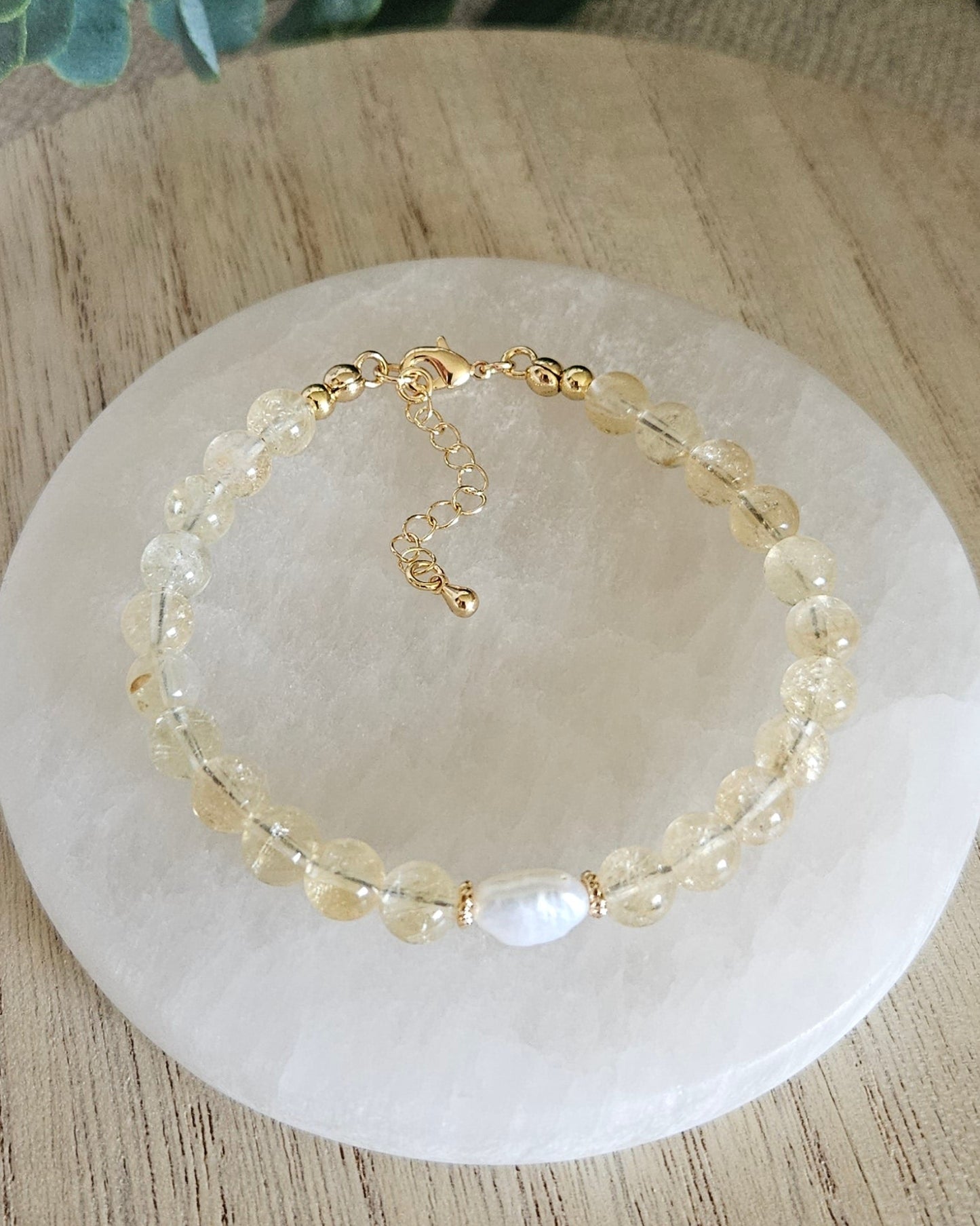 yellow beaded bracelet with a pearl