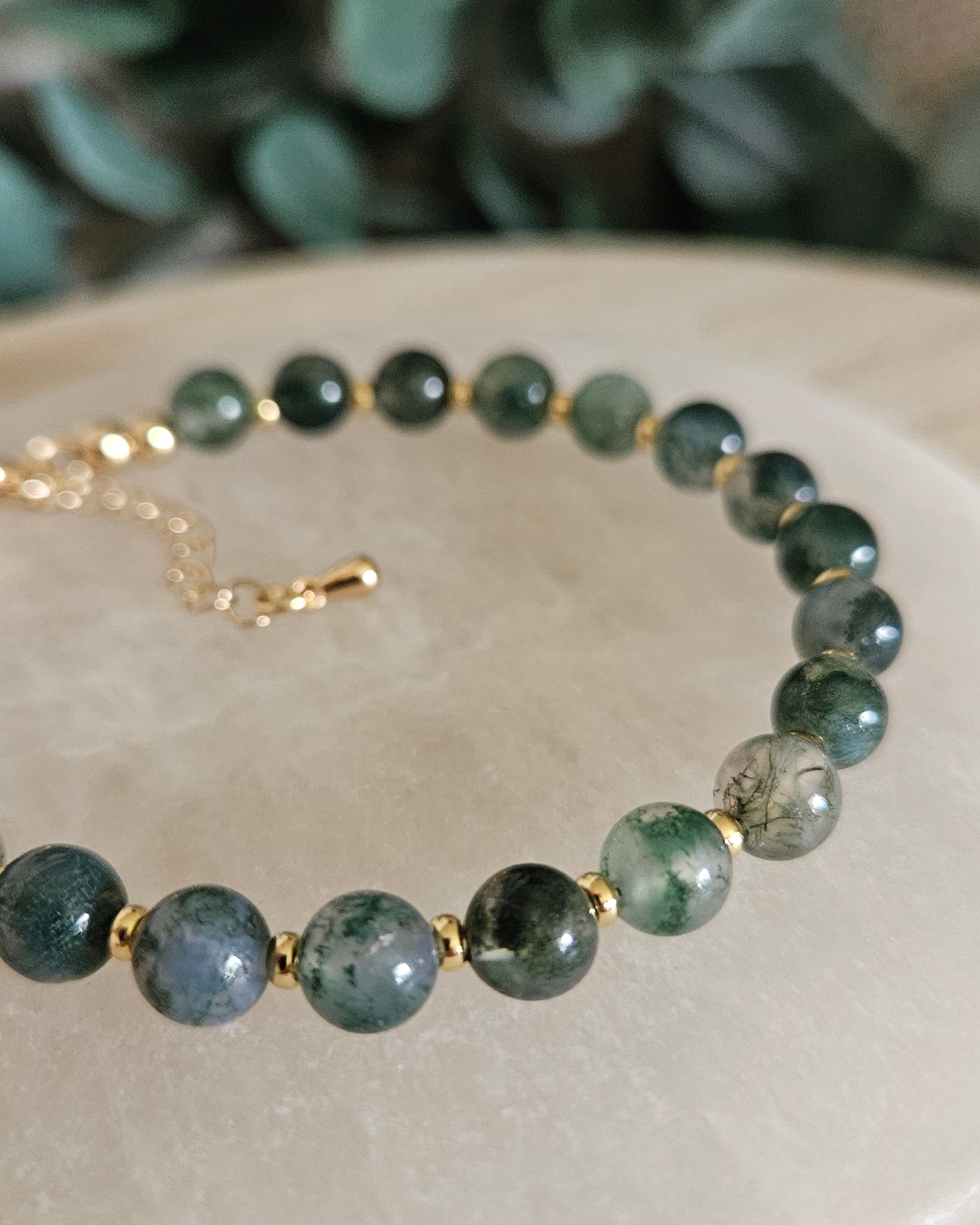 moss agate bracelet on selenite plate