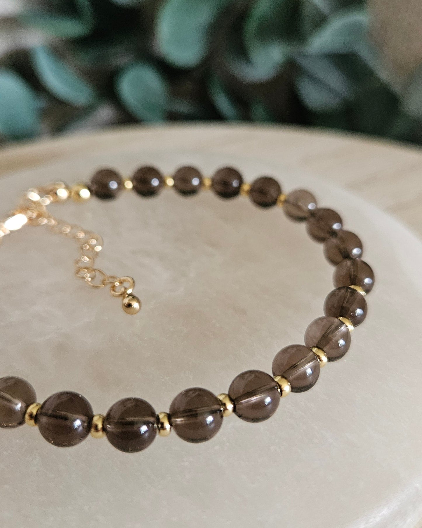 smoky quartz bracelet on selenite plate