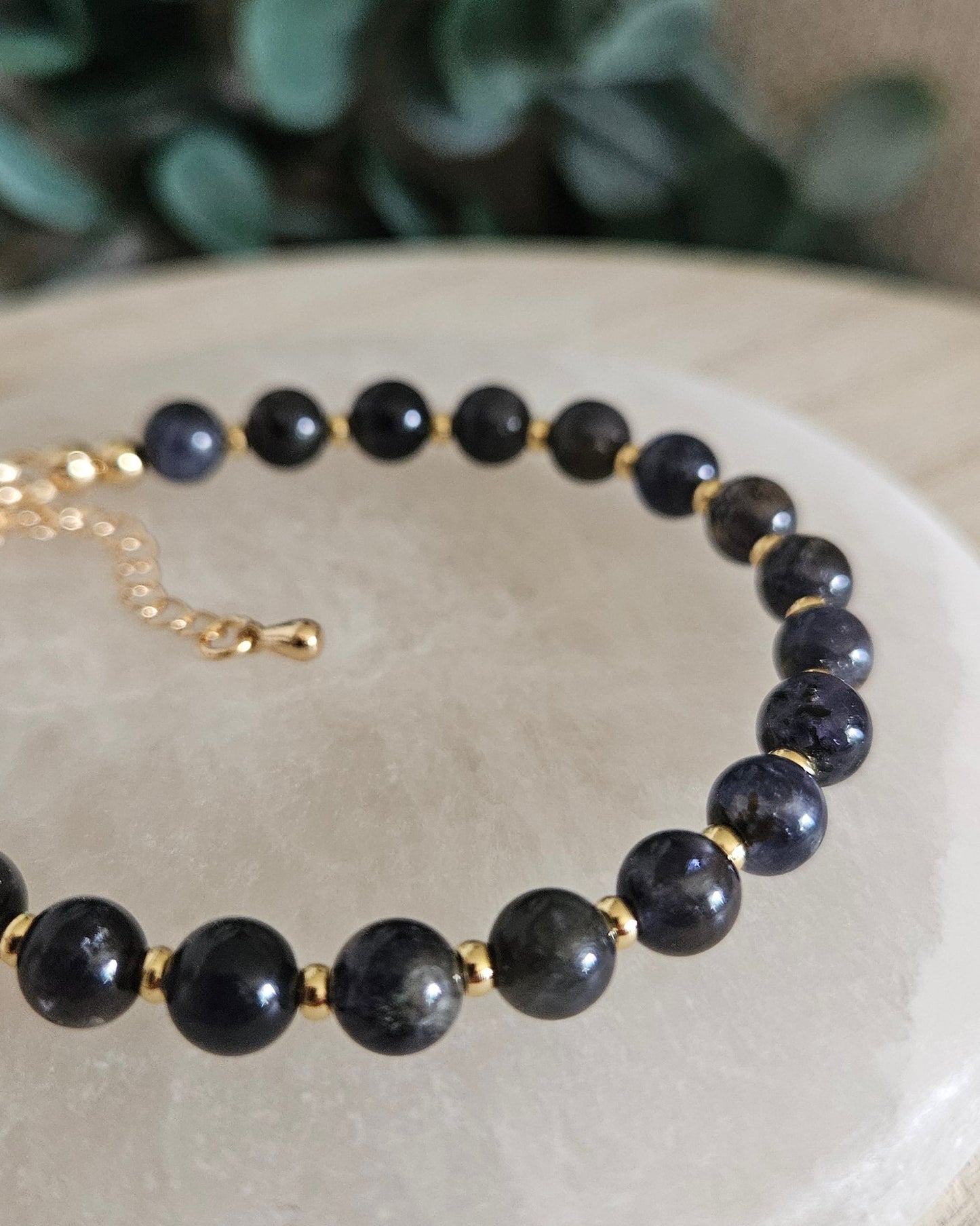 dark blue bracelet on selenite plate