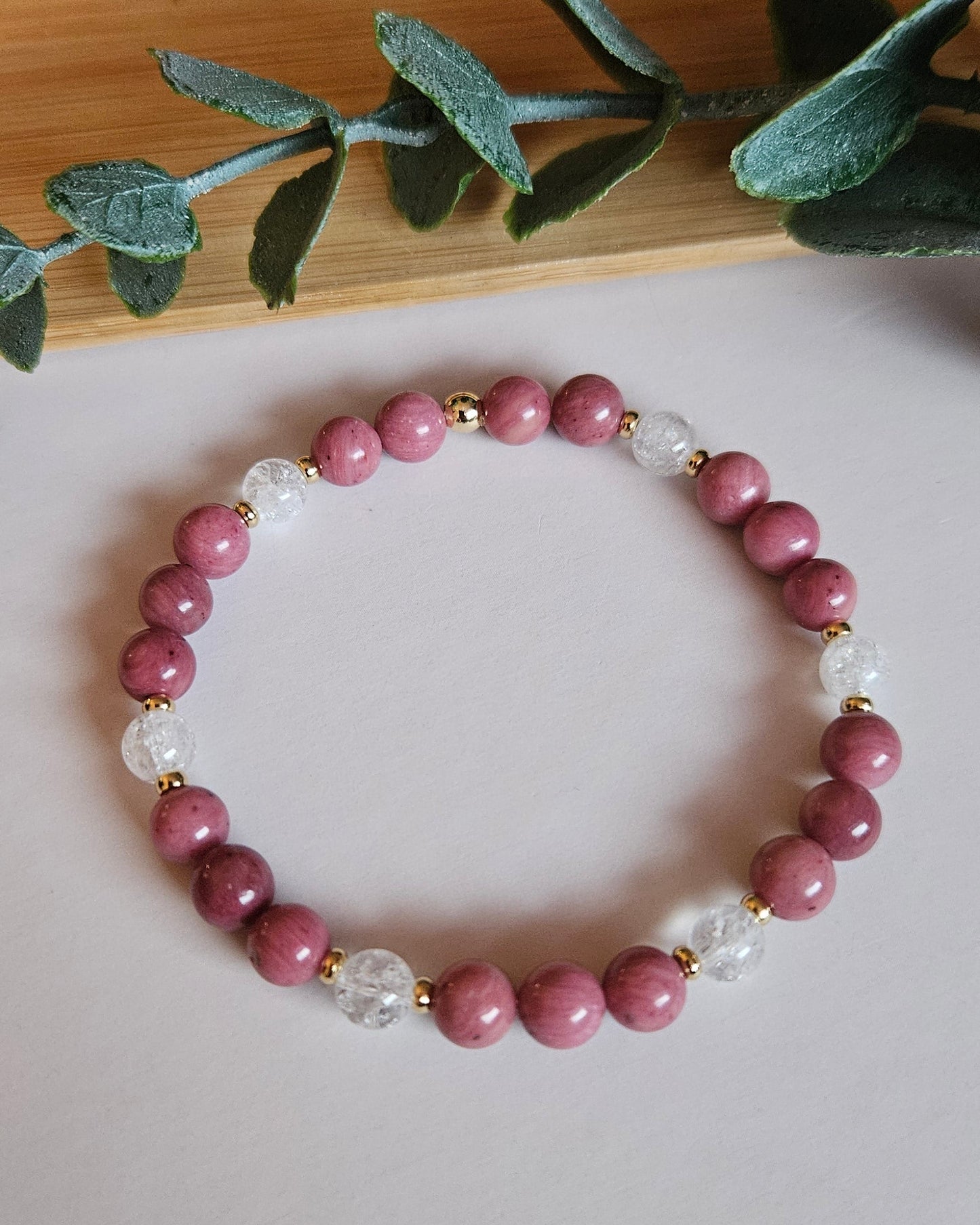 pink beaded bracelet with gold