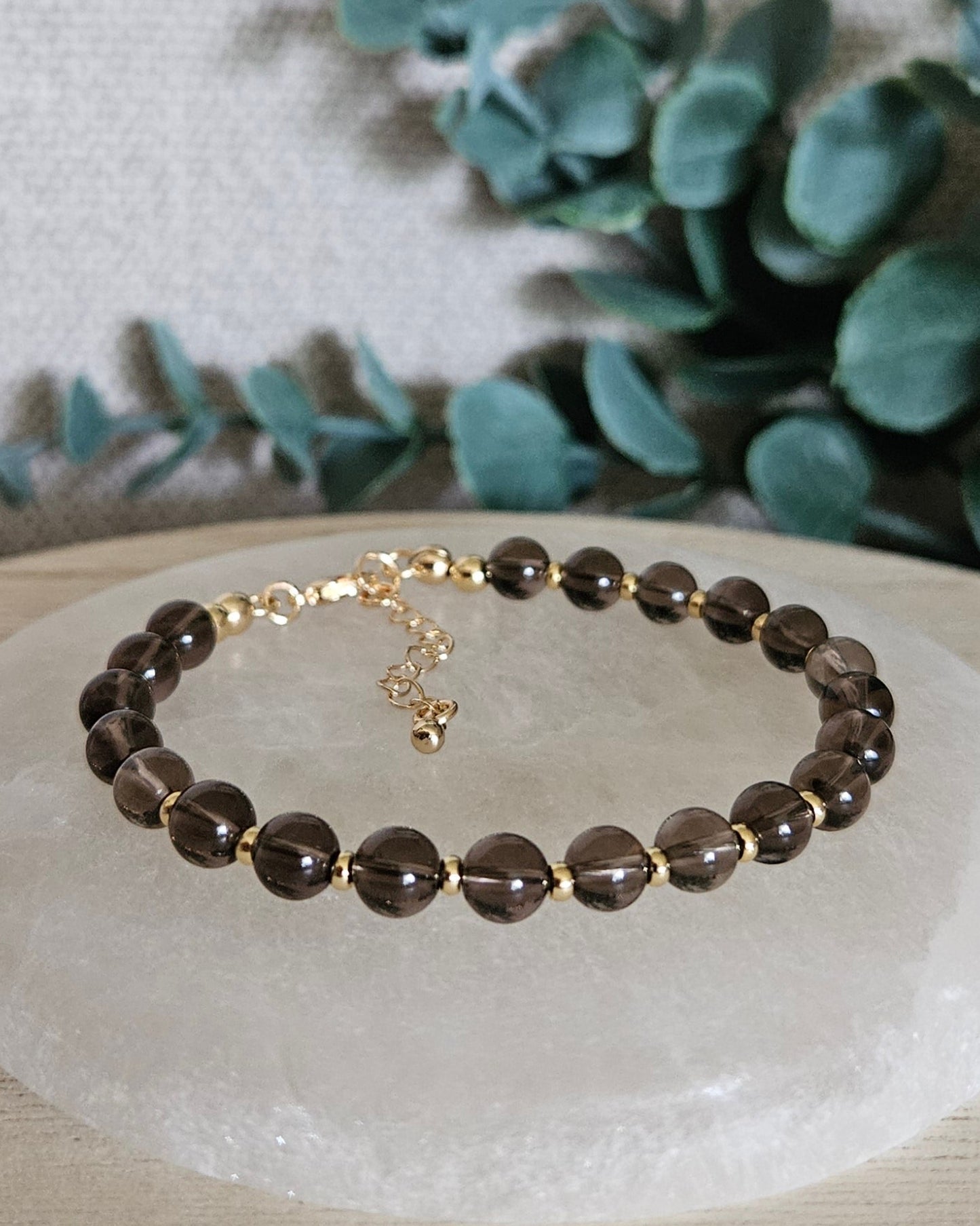 brown bracelet with gold accents