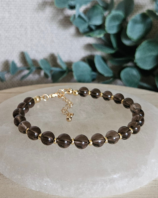 brown bracelet with gold accents