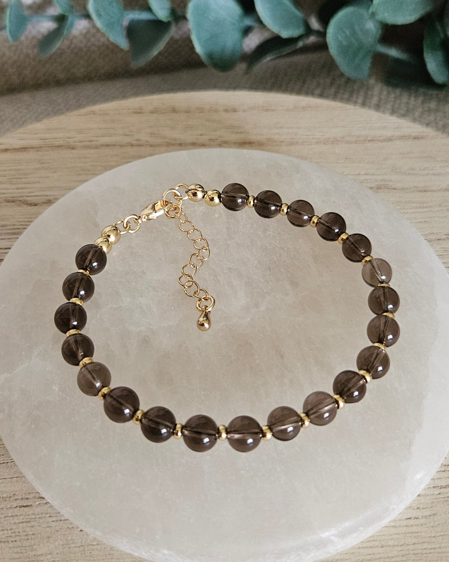 brown bracelet with gold accents
