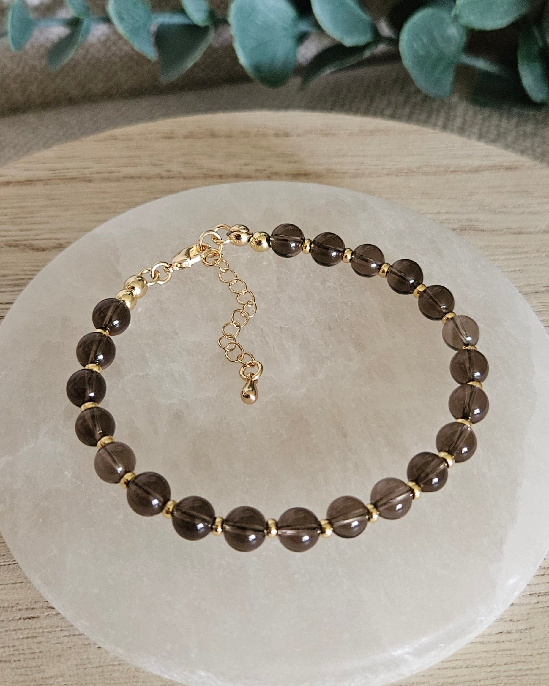 brown bracelet with gold accents