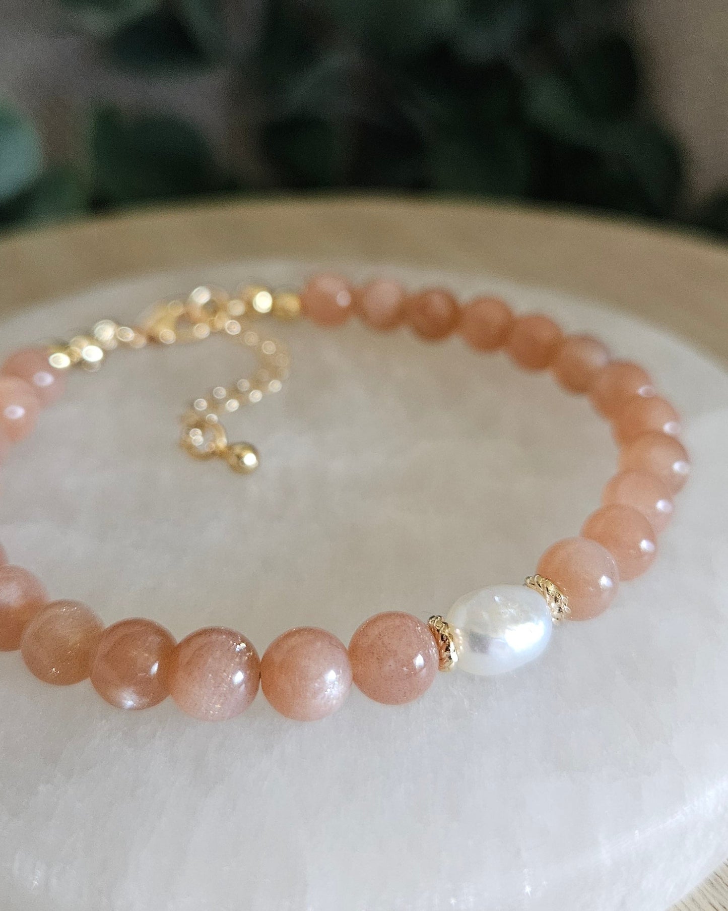 orange beaded bracelet with pearl