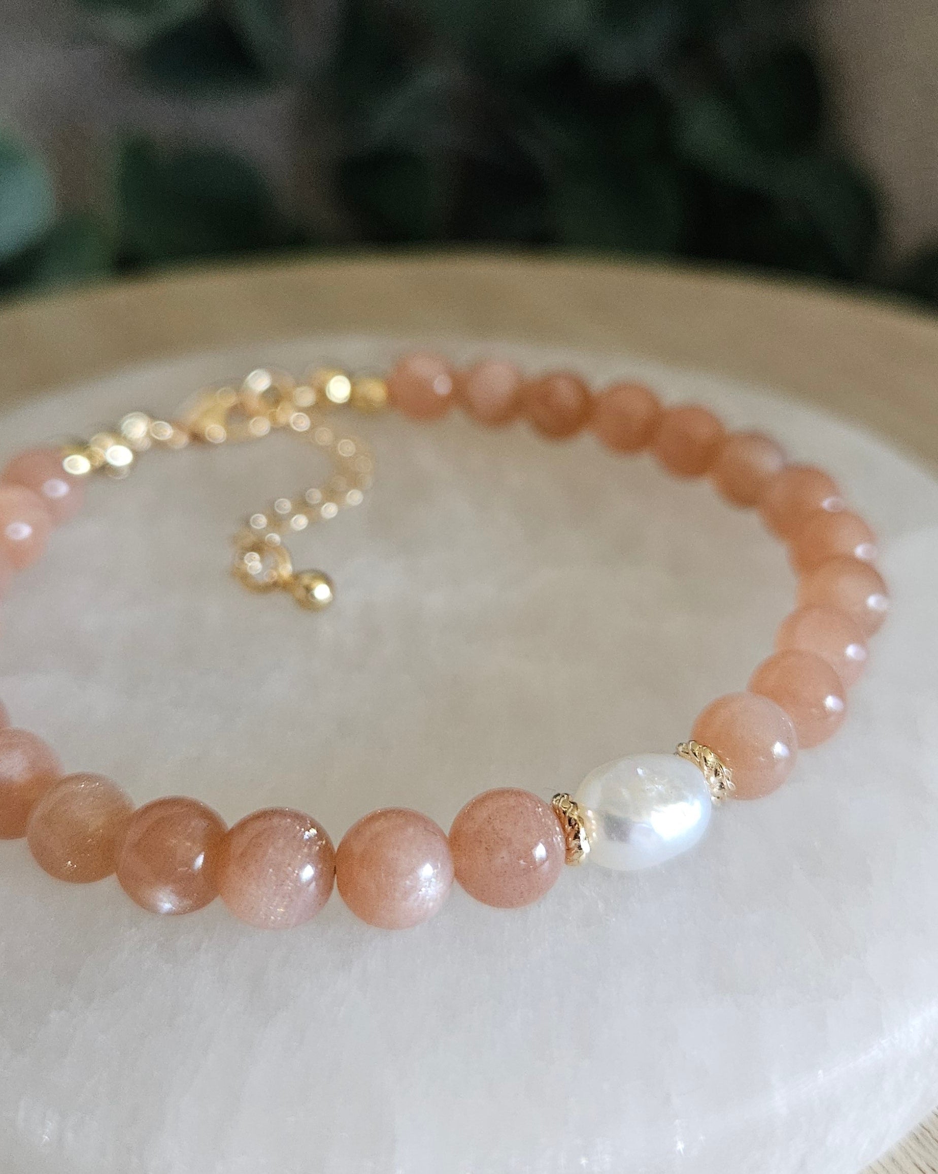 orange beaded bracelet with pearl