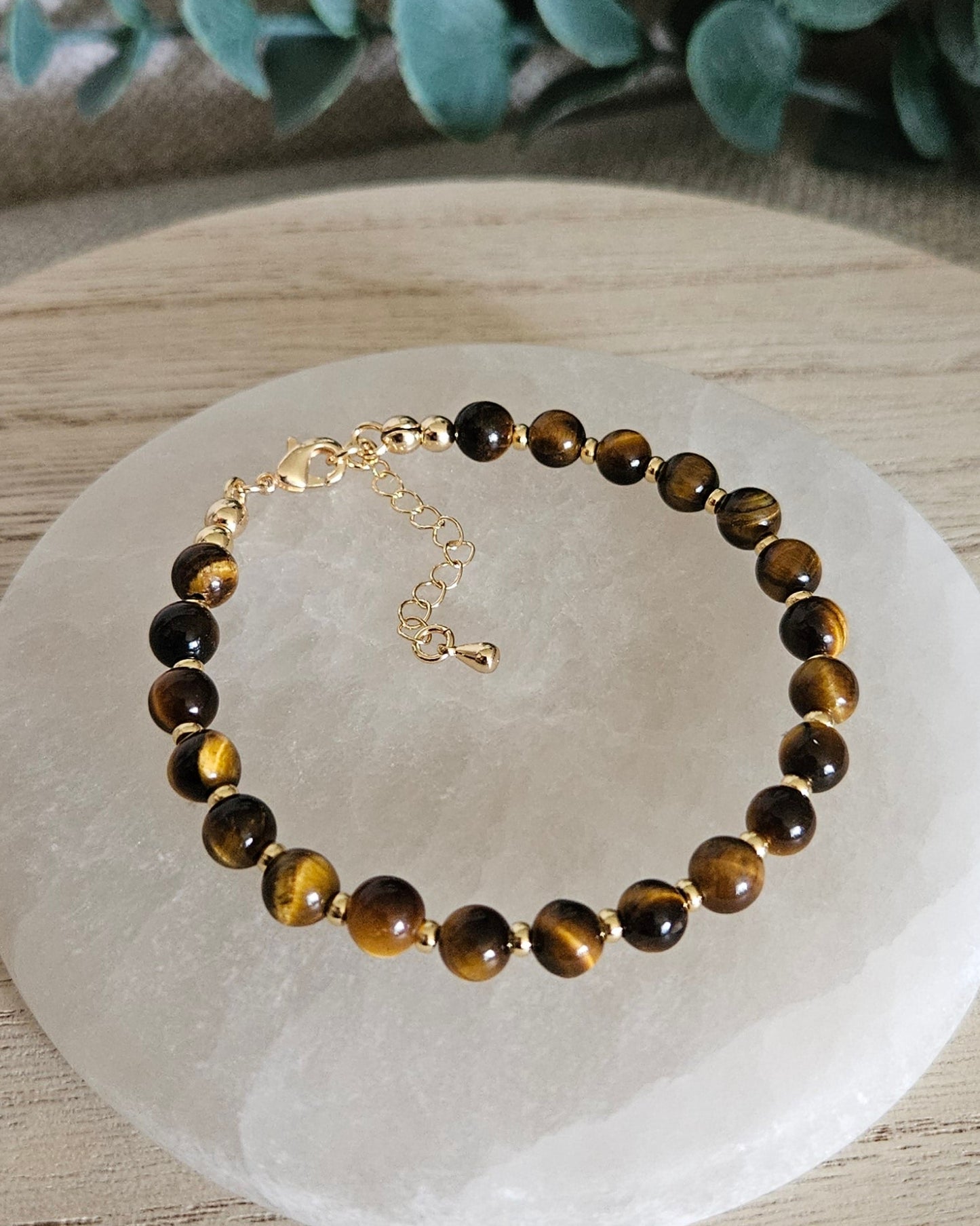 tiger's eye alt gold on selenite plate